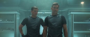 Movie still from “Ocean's Eleven” (2001), directed by Steven Soderbergh – A couple of men standing next to each other in a room; Medium shot, Low angle