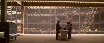 Movie still from “Ocean's Thirteen” (2007), directed by Steven Soderbergh – A group of people standing around a building; Extreme Wide shot, Low angle