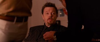 Movie still from “Ocean's Thirteen” (2007), directed by Steven Soderbergh – A person sitting in a chair; Close Up shot, Over the shoulder angle