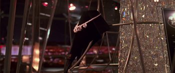 Movie still from “Ocean's Thirteen” (2007), directed by Steven Soderbergh – An umbrella that has a necklace hanging on it; Close Up shot, High angle