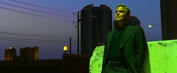 Movie still from “Ocean's Thirteen” (2007), directed by Steven Soderbergh – A man standing in front of a building at night; Medium shot, Low angle