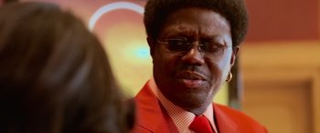 Movie still from “Ocean's Thirteen” (2007), directed by Steven Soderbergh – A person wearing a suit and tie; Close Up shot, Over the shoulder angle