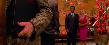 Movie still from “Ocean's Thirteen” (2007), directed by Steven Soderbergh – A man in a suit standing in front of another man; Medium shot, Over the shoulder angle