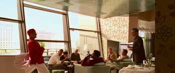 Movie still from “Ocean's Thirteen” (2007), directed by Steven Soderbergh – A group of people sitting around a table; Wide shot, Over the shoulder angle