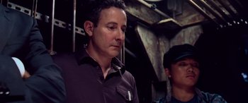 Movie still from “Ocean's Thirteen” (2007), directed by Steven Soderbergh – A person standing next to another person; Close Up shot, High angle