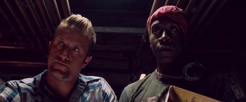 Movie still from “Ocean's Thirteen” (2007), directed by Steven Soderbergh – Two young men are standing next to each other; Close Up shot, Low angle