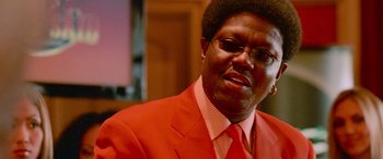 Movie still from “Ocean's Thirteen” (2007), directed by Steven Soderbergh – A person wearing a suit and tie; Close Up shot, Low angle