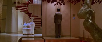 Movie still from “Ocean's Thirteen” (2007), directed by Steven Soderbergh – A man standing in front of a wall in a room; Wide shot, Low angle