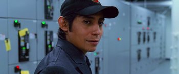 Movie still from “Ocean's Thirteen” (2007), directed by Steven Soderbergh – A man wearing a black hat and a black jacket; Close Up shot, Low angle