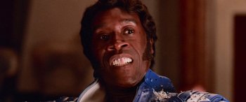 Movie still from “Ocean's Thirteen” (2007), directed by Steven Soderbergh – A person with a beard wearing a blue shirt; Close Up shot, Low angle