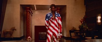 Movie still from “Ocean's Thirteen” (2007), directed by Steven Soderbergh – A man in a suit with an american flag design; Medium shot, Low angle