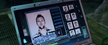 Movie still from “Ocean's Thirteen” (2007), directed by Steven Soderbergh – A computer screen with a picture of a man on it; Extreme Close Up shot, High angle