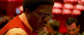 Movie still from “Ocean's Thirteen” (2007), directed by Steven Soderbergh – A person wearing glasses and a red tie; Close Up shot, Low angle