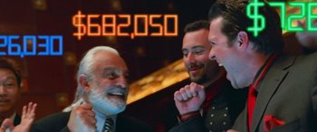 Movie still from “Ocean's Thirteen” (2007), directed by Steven Soderbergh – A group of men standing next to each other in a room; Extreme Close Up shot, Over the shoulder angle