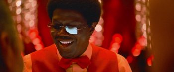 Movie still from “Ocean's Thirteen” (2007), directed by Steven Soderbergh – A person wearing glasses and a bow tie; Close Up shot, Low angle