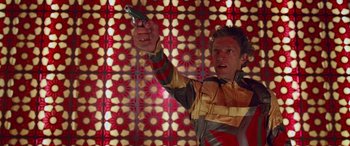 Movie still from “Ocean's Thirteen” (2007), directed by Steven Soderbergh – A man holding a cell phone in his hand; Medium shot, Low angle