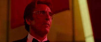 Movie still from “Ocean's Thirteen” (2007), directed by Steven Soderbergh – A person wearing glasses and a bow tie; Close Up shot, Low angle