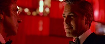 Movie still from “Ocean's Thirteen” (2007), directed by Steven Soderbergh – A person wearing a suit and tie; Close Up shot, Low angle