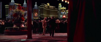 Movie still from “Ocean's Thirteen” (2007), directed by Steven Soderbergh – A crowd of people standing on the street at night; Wide shot, High angle