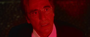 Movie still from “Ocean's Thirteen” (2007), directed by Steven Soderbergh – An older man wearing glasses and a pink shirt; Close Up shot, Low angle