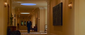 Movie still from “Ocean's Thirteen” (2007), directed by Steven Soderbergh – A man in a suit walks down a hall way; Wide shot, Low angle