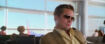 Movie still from “Ocean's Thirteen” (2007), directed by Steven Soderbergh – A person wearing a suit and sunglasses; Close Up shot, Low angle