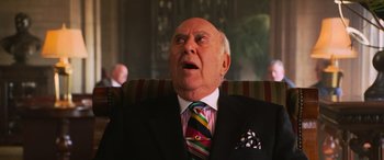 Movie still from “Ocean's Twelve” (2004), directed by Steven Soderbergh – An older man wearing a suit and tie looking upward; Close Up shot, Low angle