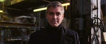 Movie still from “Ocean's Twelve” (2004), directed by Steven Soderbergh – A person wearing a black jacket; Close Up shot, Over the shoulder angle