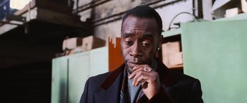 Movie still from “Ocean's Twelve” (2004), directed by Steven Soderbergh – A person wearing a suit and tie; Close Up shot, Low angle