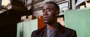 Movie still from “Ocean's Twelve” (2004), directed by Steven Soderbergh – A person wearing a jacket; Close Up shot, Low angle