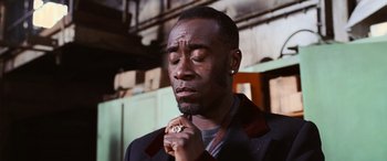 Movie still from “Ocean's Twelve” (2004), directed by Steven Soderbergh – A man with his hands clasped in front of his face; Close Up shot, Low angle