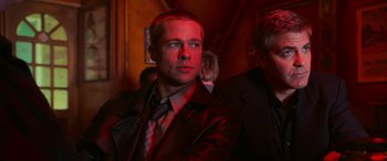 Movie still from “Ocean's Twelve” (2004), directed by Steven Soderbergh – A man wearing a leather jacket and a tie; Close Up shot, Low angle