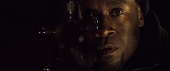 Movie still from “Ocean's Twelve” (2004), directed by Steven Soderbergh – A person looking through a scope; Extreme Close Up shot, Over the shoulder angle