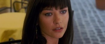 Movie still from “Ocean's Twelve” (2004), directed by Steven Soderbergh – A woman's face with long black hair; Close Up shot, High angle