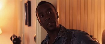 Movie still from “Ocean's Twelve” (2004), directed by Steven Soderbergh – A person wearing a button up shirt; Close Up shot, Over the shoulder angle