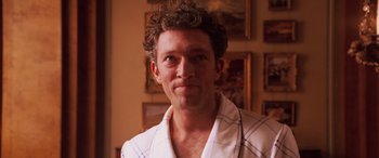 Movie still from “Ocean's Twelve” (2004), directed by Steven Soderbergh – A person wearing a robe; Close Up shot, Low angle