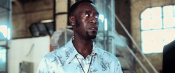 Movie still from “Ocean's Twelve” (2004), directed by Steven Soderbergh – A man in a white shirt is looking to his left; Close Up shot, Low angle