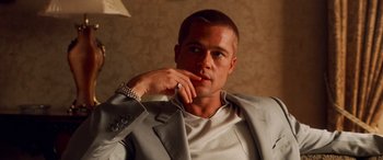 Movie still from “Ocean's Twelve” (2004), directed by Steven Soderbergh – A person wearing a suit and tie; Close Up shot, Low angle