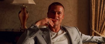 Movie still from “Ocean's Twelve” (2004), directed by Steven Soderbergh – A person wearing a suit and tie; Close Up shot, Low angle