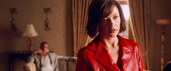 Movie still from “Ocean's Twelve” (2004), directed by Steven Soderbergh – A person wearing a red jacket; Close Up shot, Over the shoulder angle