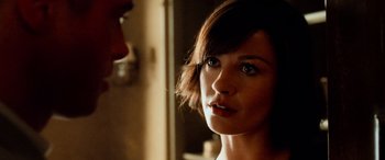 Movie still from “Ocean's Twelve” (2004), directed by Steven Soderbergh – A person with short brown hair; Close Up shot, Over the shoulder angle