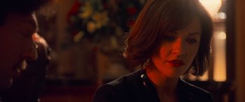 Movie still from “Ocean's Twelve” (2004), directed by Steven Soderbergh – A person wearing a black shirt; Close Up shot, Over the shoulder angle