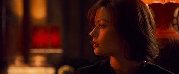 Movie still from “Ocean's Twelve” (2004), directed by Steven Soderbergh – A person looking to the side; Close Up shot, Over the shoulder angle