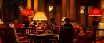 Movie still from “Ocean's Twelve” (2004), directed by Steven Soderbergh – A man and a woman are sitting at a table; Wide shot, Over the shoulder angle