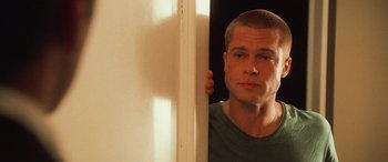 Movie still from “Ocean's Twelve” (2004), directed by Steven Soderbergh – A person holding a mirror; Close Up shot, Over the shoulder angle