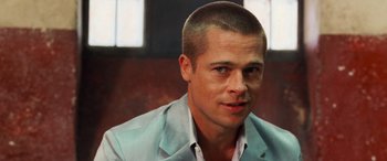 Movie still from “Ocean's Twelve” (2004), directed by Steven Soderbergh – A person wearing a suit; Close Up shot, Over the shoulder angle