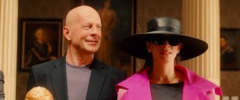 Movie still from “Ocean's Twelve” (2004), directed by Steven Soderbergh – A man and a woman wearing hats posing for a picture; Close Up shot, Low angle