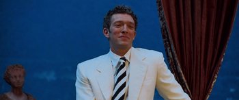 Movie still from “Ocean's Twelve” (2004), directed by Steven Soderbergh – A person wearing a suit and a tie; Close Up shot, Low angle