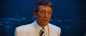 Movie still from “Ocean's Twelve” (2004), directed by Steven Soderbergh – A person wearing a suit and tie; Close Up shot, High angle