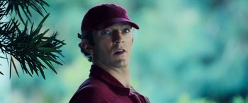 Movie still from “Ocean's Twelve” (2004), directed by Steven Soderbergh – A person wearing a hat; Close Up shot, Low angle